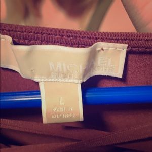 Woman’s burgundy and gold Michael Kors top